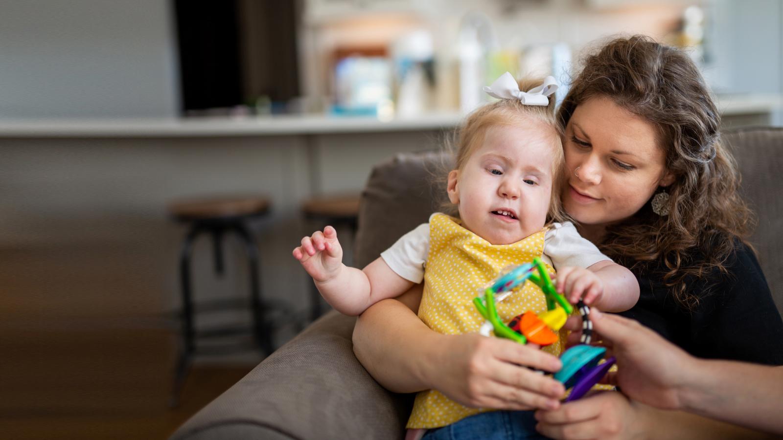 a woman holding a baby