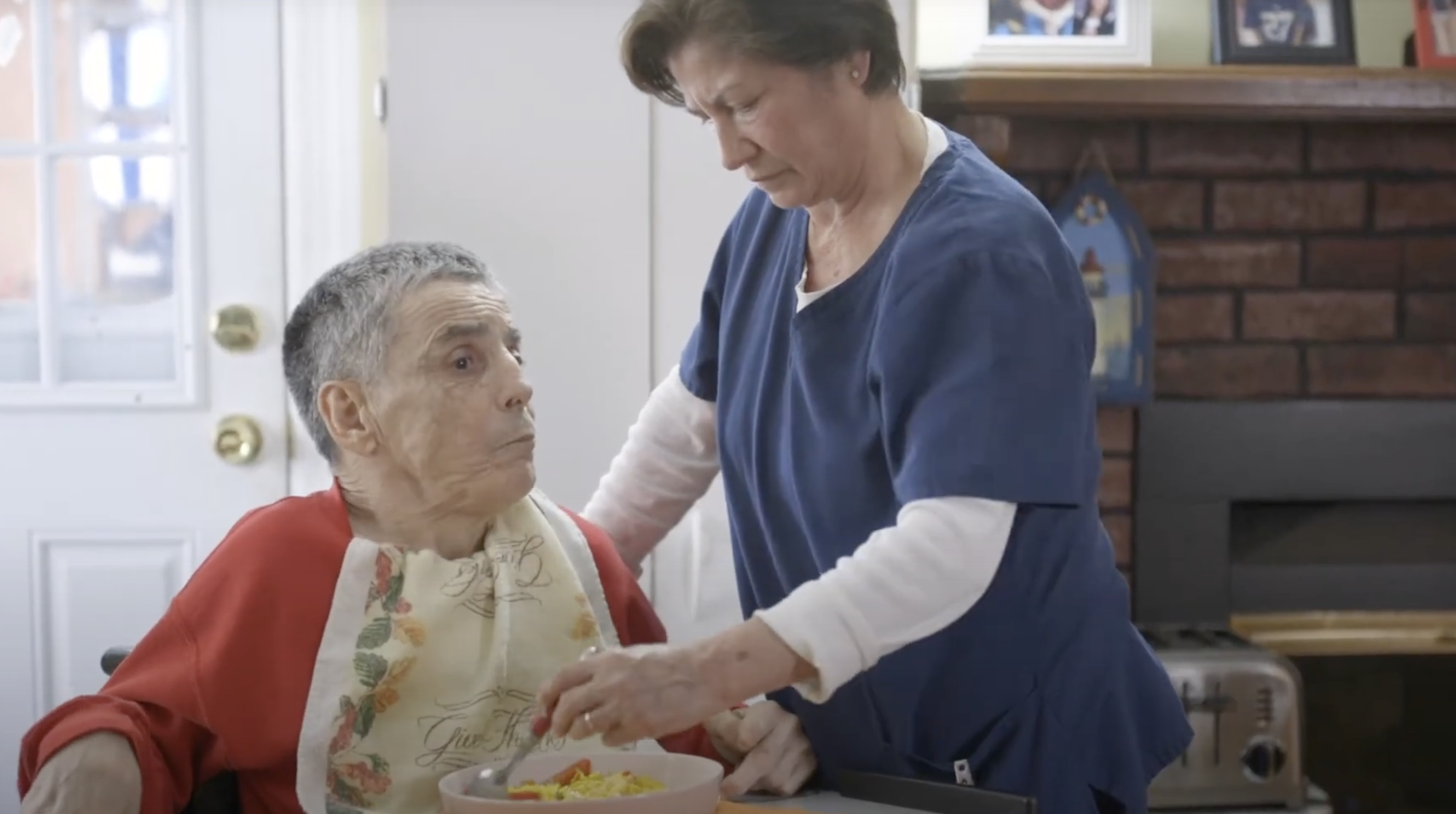a woman feeding a man