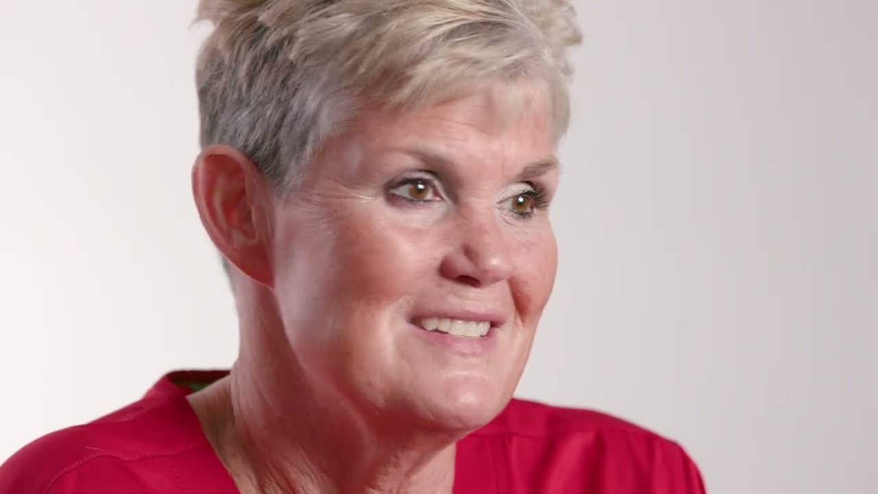 a woman in a red shirt