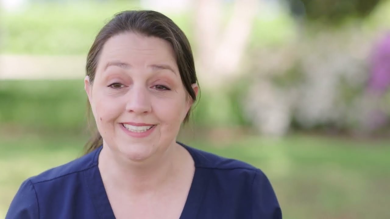 a woman smiling at camera
