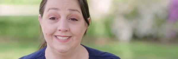a woman smiling at camera