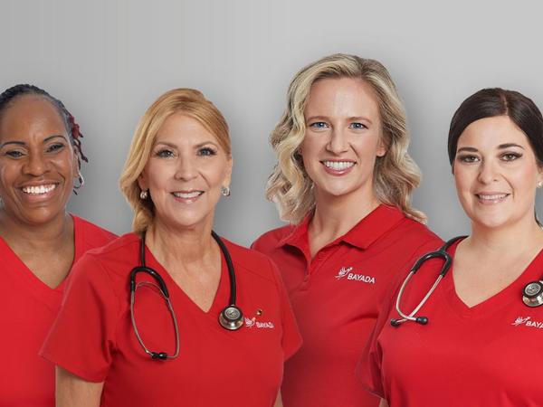 a group of women wearing red shirts