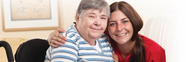 a woman in a wheelchair with a nurse