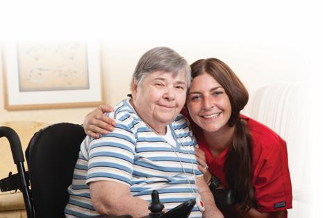 a woman in a wheelchair with a nurse
