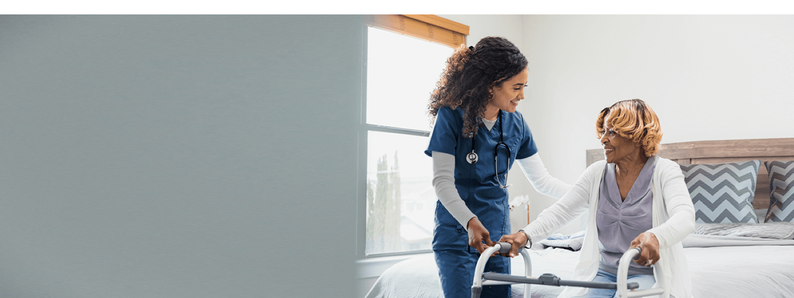 a nurse pushing a walker with a patient