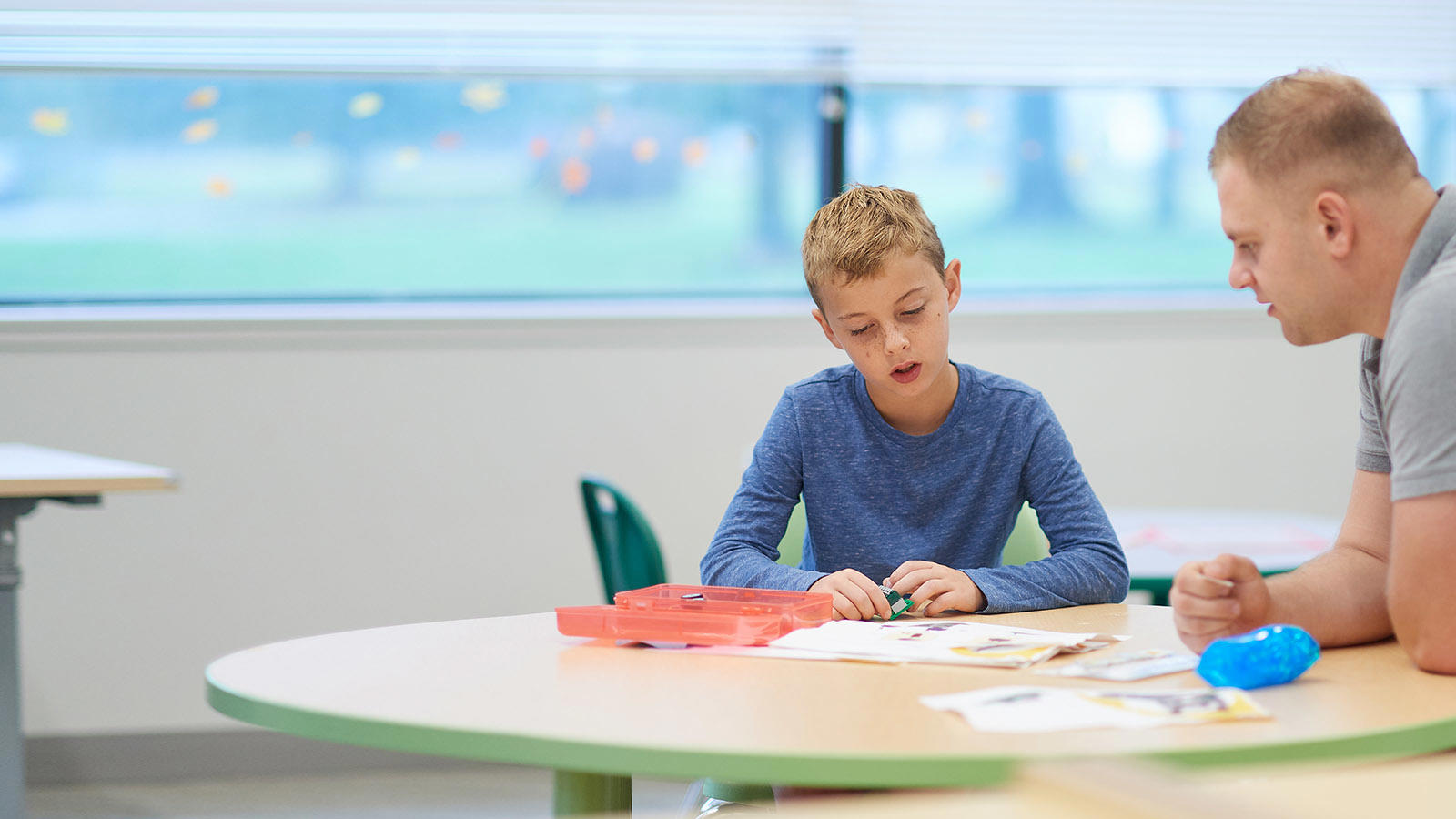 a boy sitting at a table