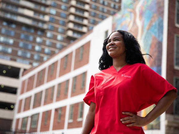 a woman in a red scrubs