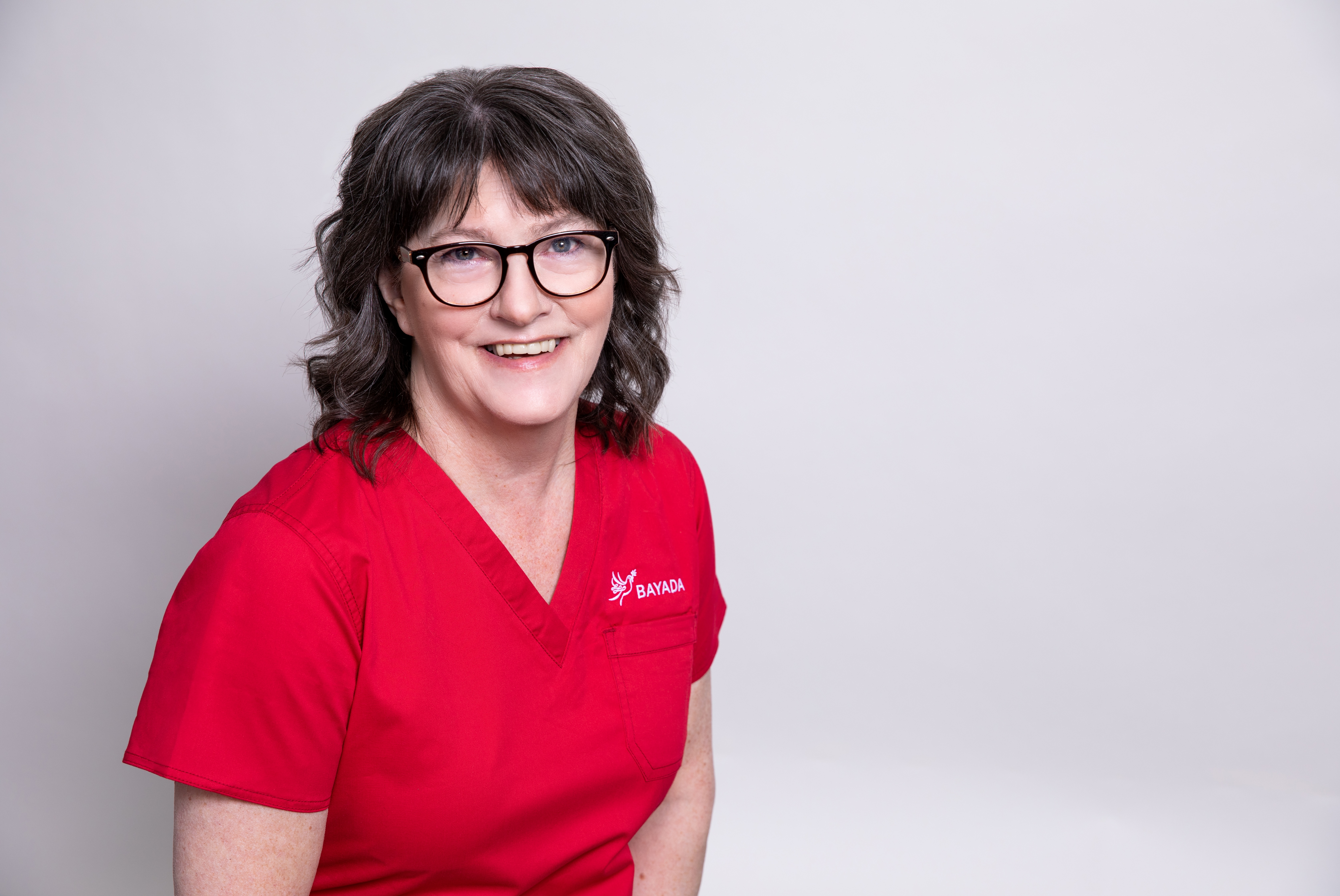 a woman in a red shirt