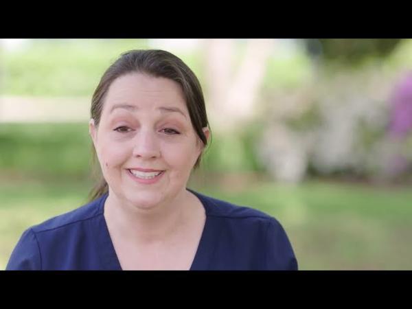 a woman smiling at camera