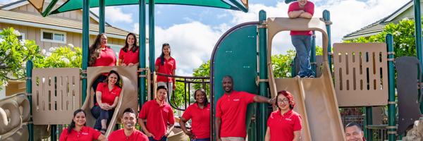 a group of people in red shirts