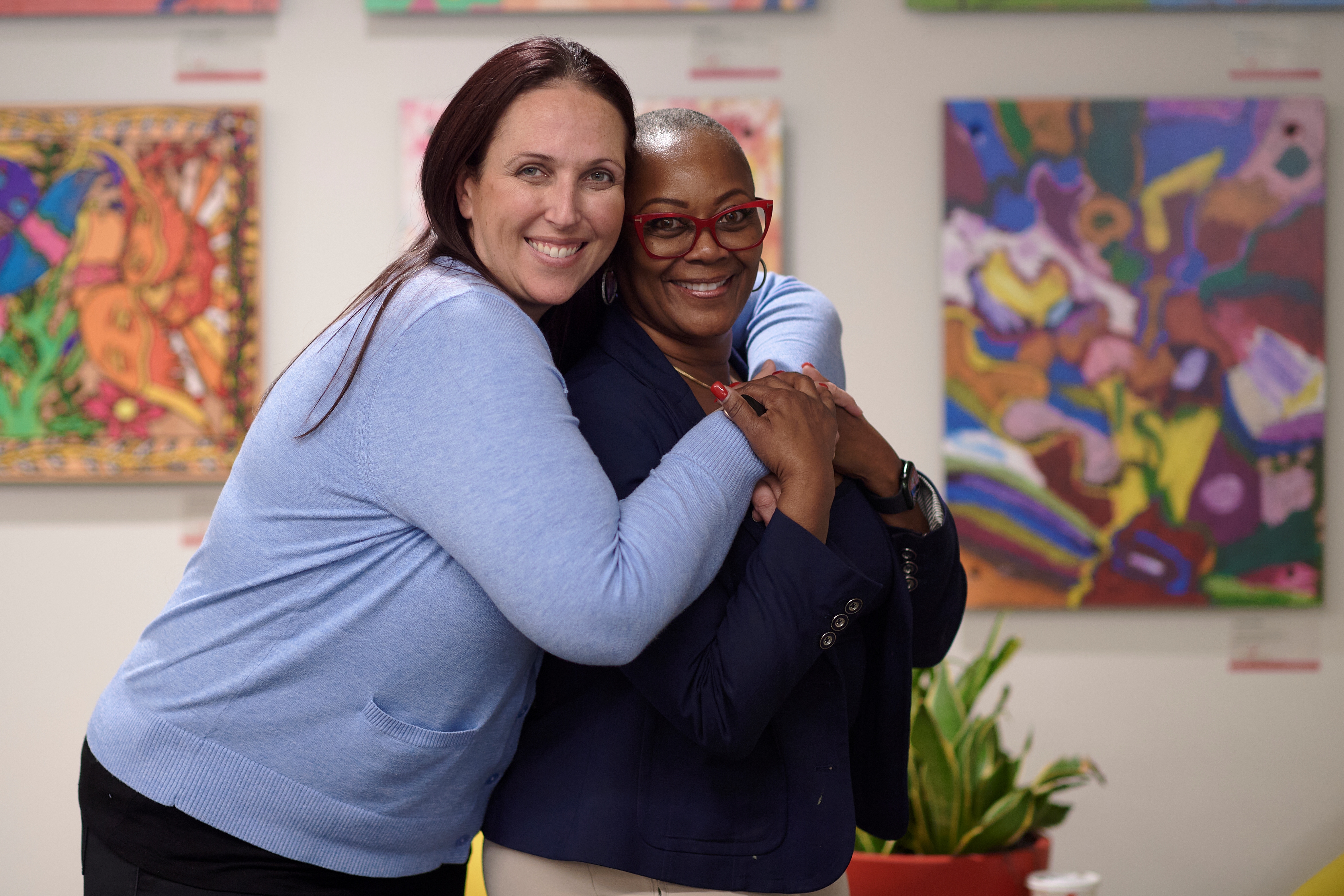 two women hugging each other