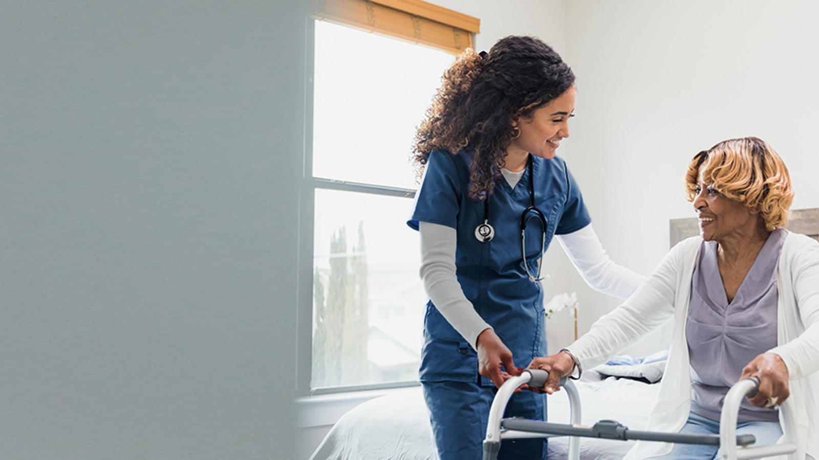 a nurse helping a patient to walk