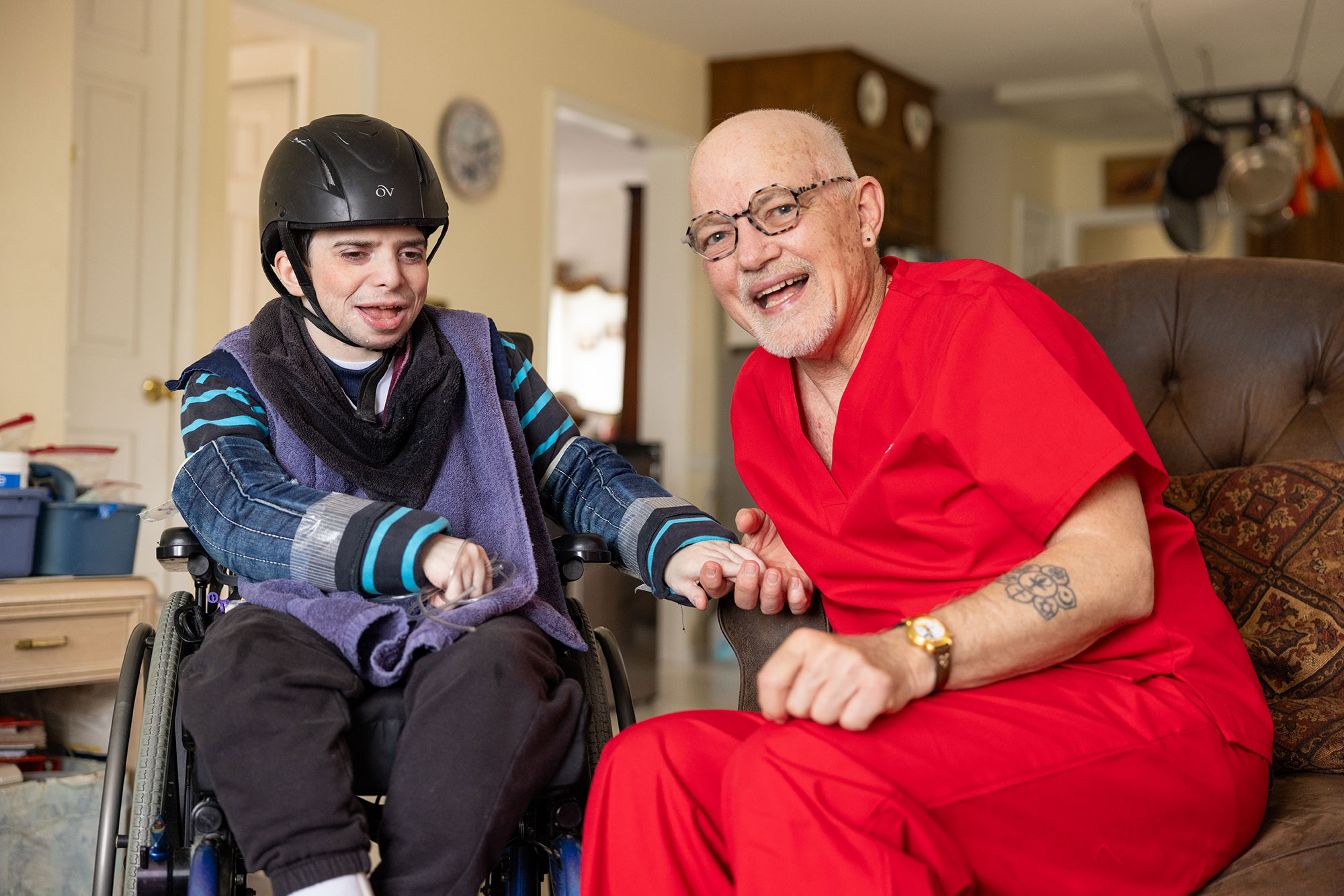 a man in a wheelchair and a woman in a helmet